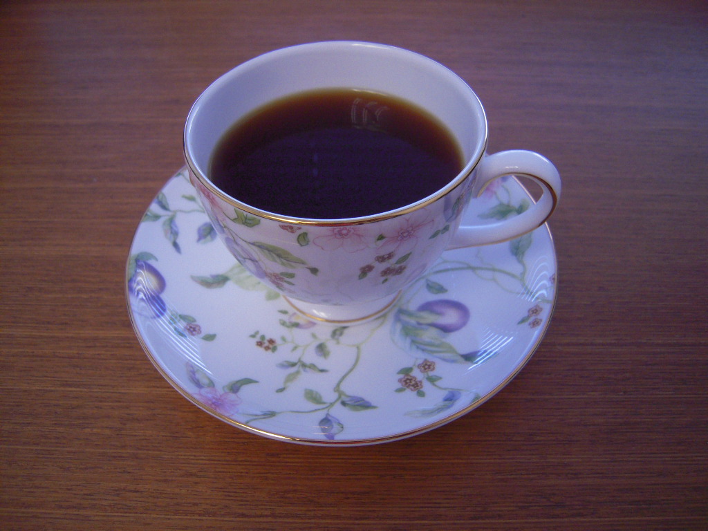 tea in porcelain cup and saucer